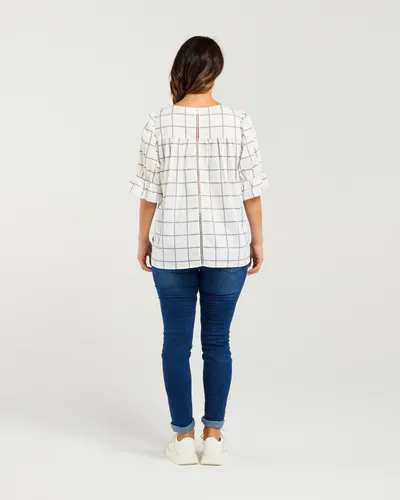 Model wearing White Grid Sadie Top By Seduce Available at Beetees Nelson